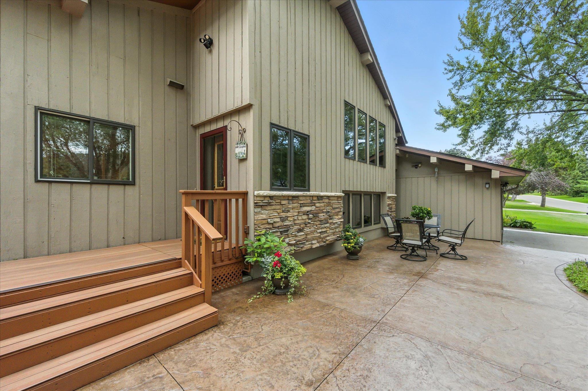 Enjoy this maintenance free deck and great stamped and colored patio.