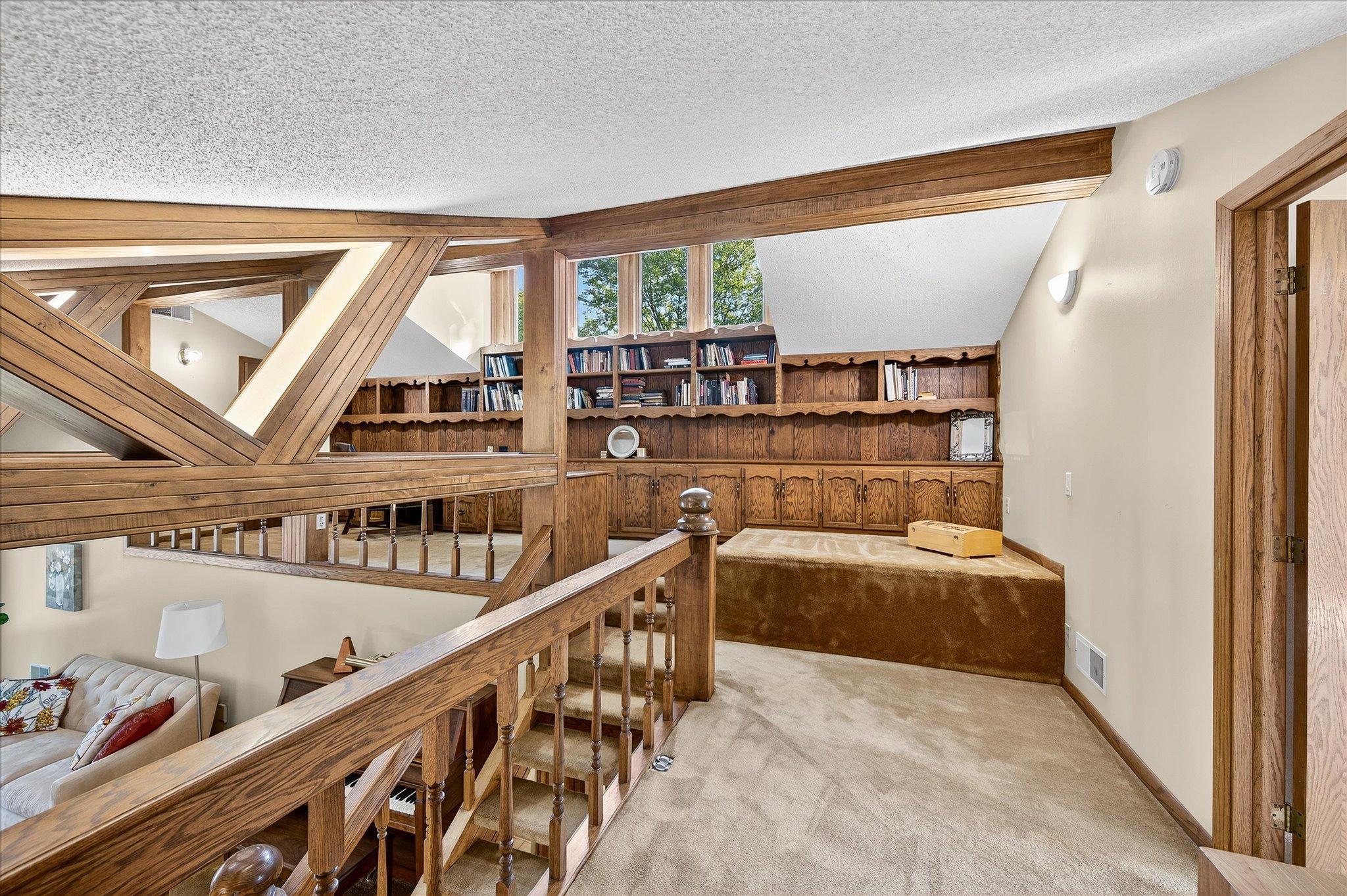 Balcony off of bedroom. Great office area with lots of bookcases and cupboards for storage.
