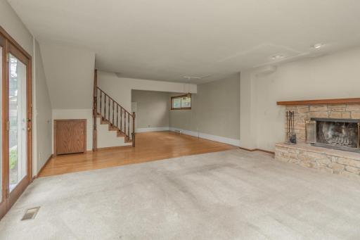 Living room with dining room in background.