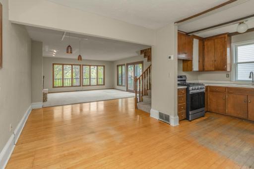 Open concept kitchen, dining and living rooms.