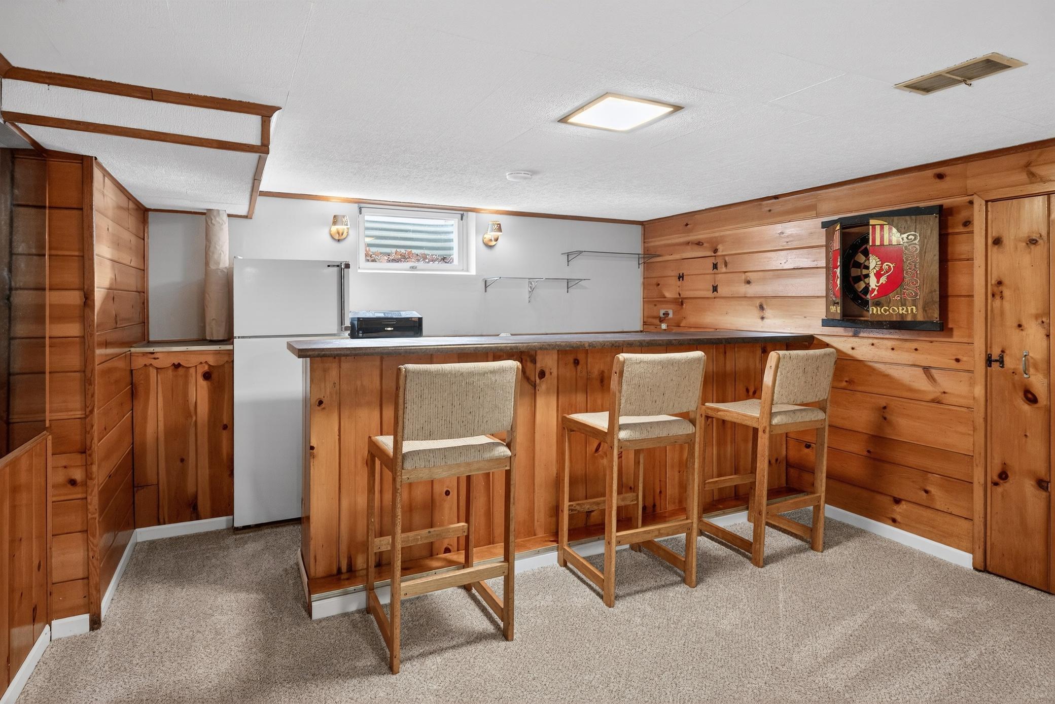 With wet bar & fridge for fun times...