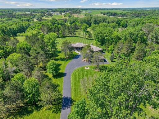 Tucked away on over 3 private, wooded acres with views of the 6th hole at St. Croix National Golf Club, this thoughtfully crafted 3 bed, 3 bath residence offers a refined take on craftsman design.