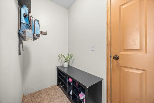 The mudroom off the garage is perfect to drop your shoes and jackets out of sight when entering from the garage.
