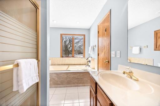 Full upper level bathroom with large tub, and shower.