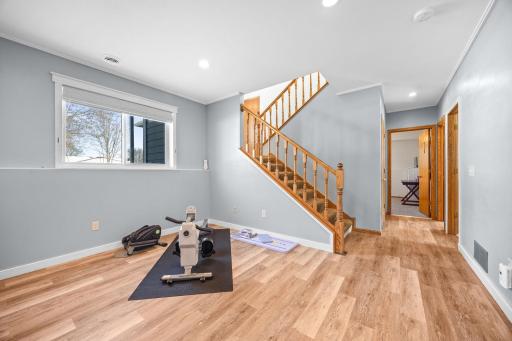 The family room is large enough to include a workout area and leads to more bedrooms and office space on the other end.