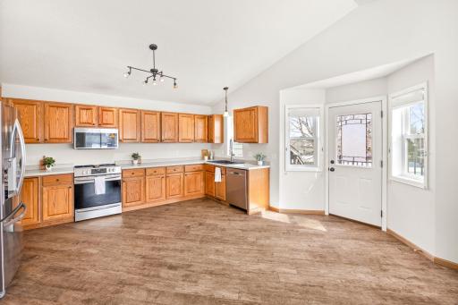 The large kitchen features newer tile floors (2015), updated appliances, a newer sink and so much storage and counter space for your every day needs.