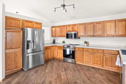 There is plenty room to add an island to this kitchen if desired. Dishwasher, microwave and stove were replaced in 2020/21, the refrigerator was installed in 2015.