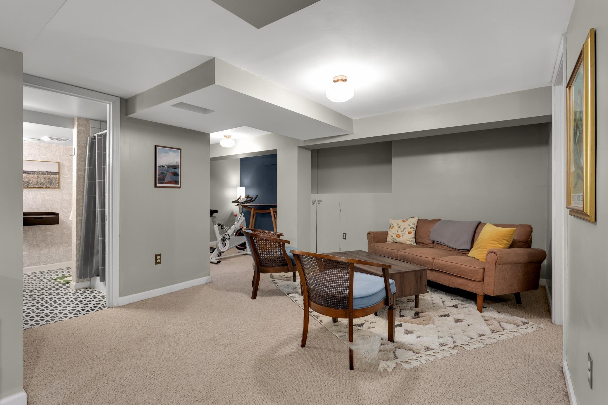 Finished lower level with exercise or office nook.