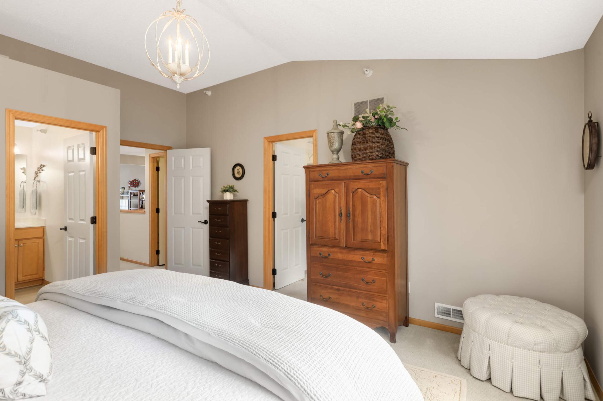 Primary suite offers a generous walk-in closet with excellent storage and organization.