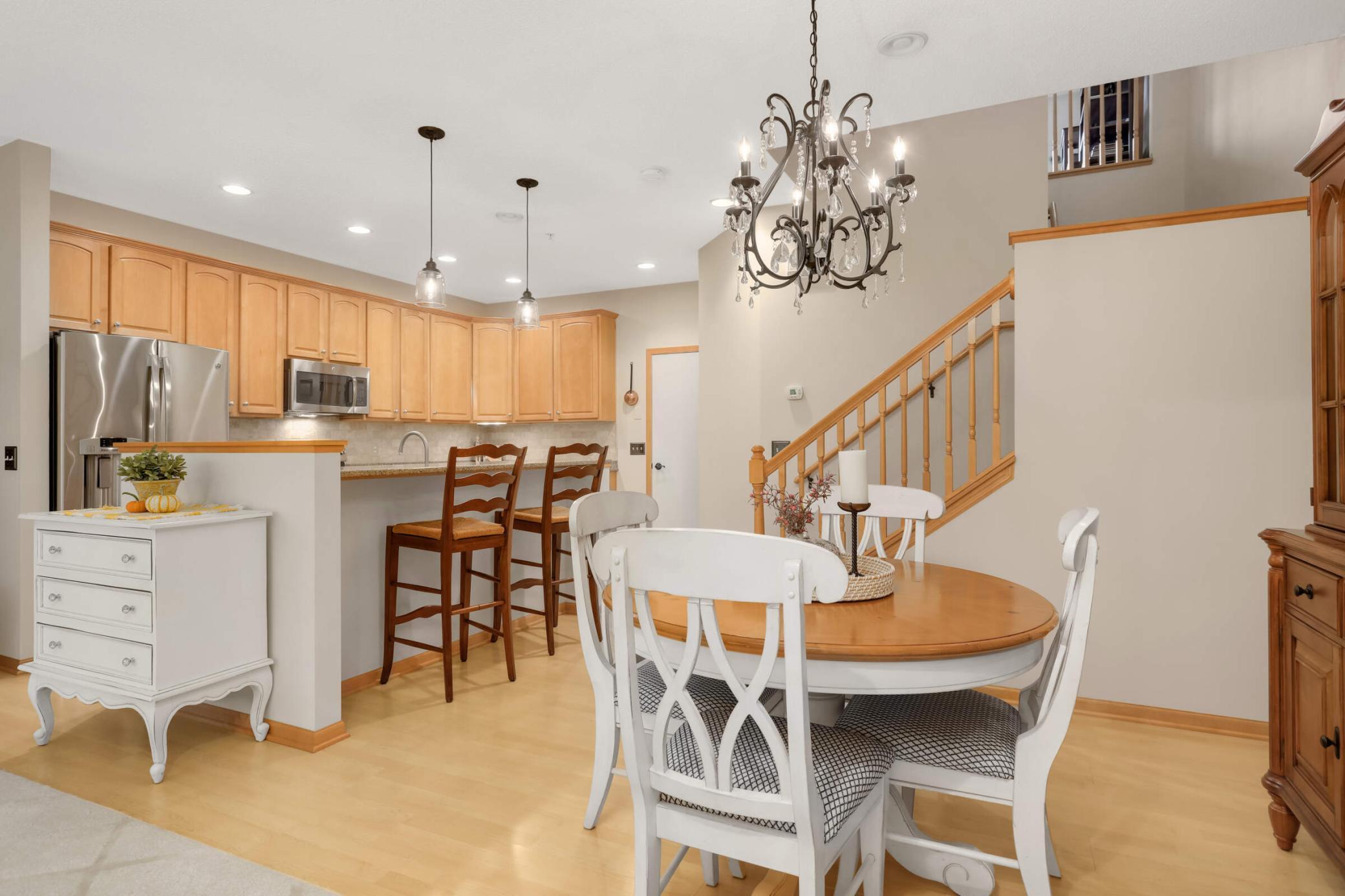 The dining area flows seamlessly between the kitchen and living room, creating an open, functional space perfect for everyday living and entertaining.