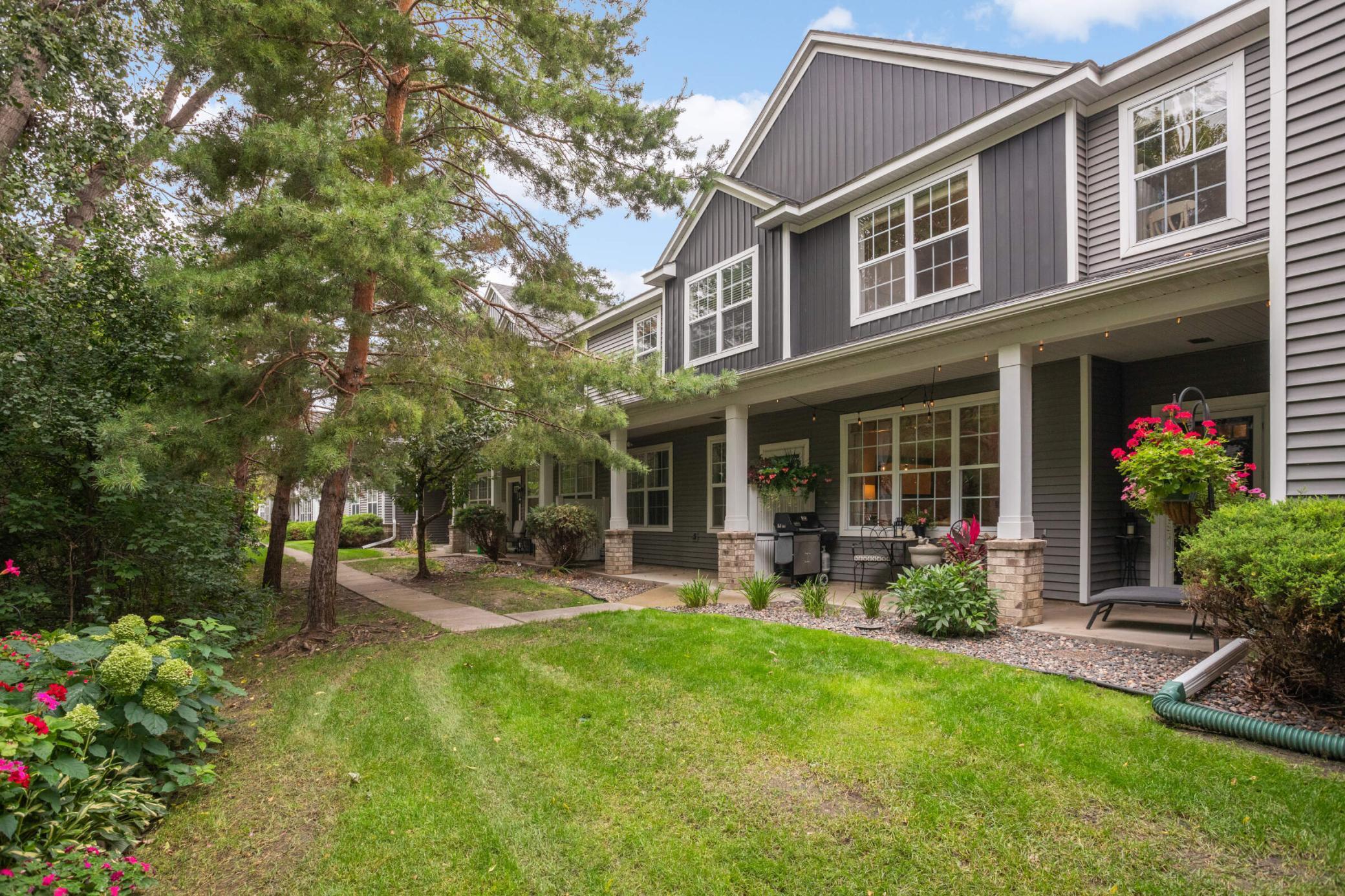 Lush flower bed with mature blooms and stunning hydrangeas, creating a vibrant, garden like oasis.