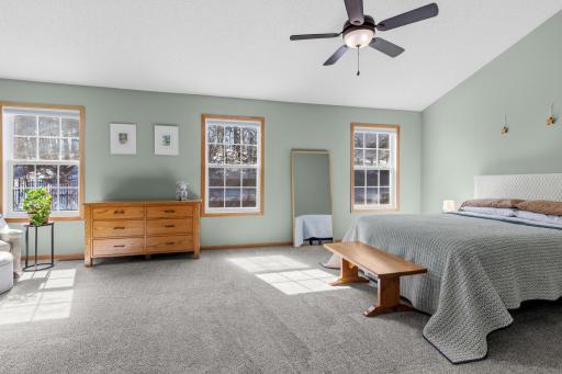 Tucked privately away from the main floor living areas, the upper level bedrooms continue the theme of light and airy.