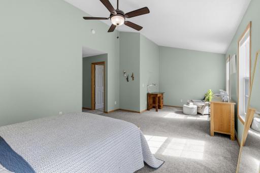 The primary boasts a vaulted ceiling and plenty of space for a private sitting area.