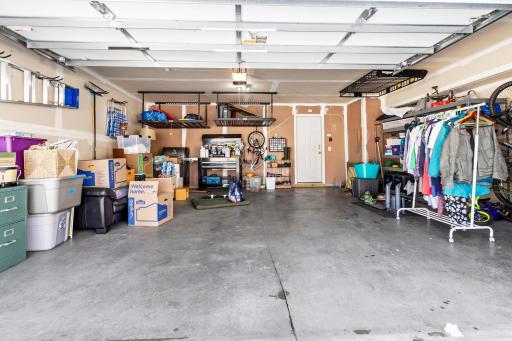 The two-car garage has enough height for most vehicles and offers additional storage space, as well. The garage opens into the home's lower level.