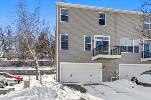 The garage and private drive (more parking for you or guests) sits just under the home's balcony.