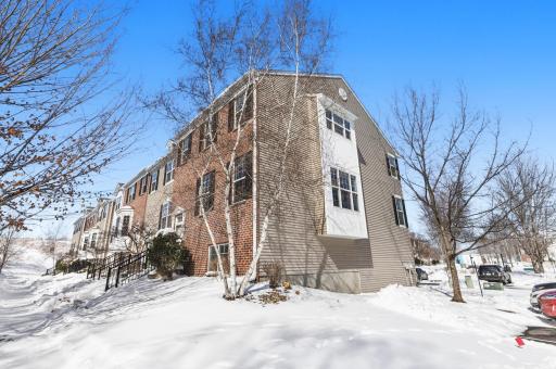 This end unit town home is surrounded by windows on three sides and sits right next to guest parking--so convenient when you're entertaining.