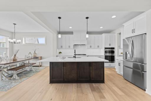 This stunning interior showcases the St. Croix plan featuring a gourmet kitchen with premium finishes throughout.