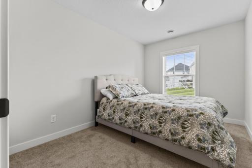 Lower level 5th bedroom is an ideal guest room.