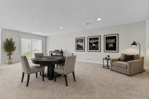 Lower level walk out with massive amount of space for recreation and relaxing. Wet bar rough as well. This room is virtually staged.