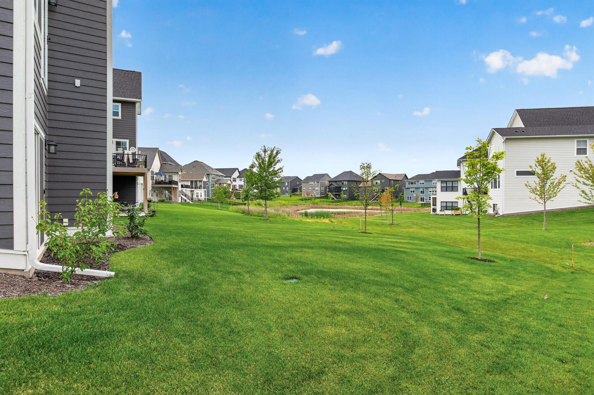 Generous back yard with a peaceful pond views. Full irrigation for a lush lawn during the warm months.