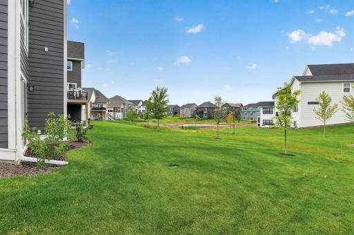 Generous back yard with a peaceful pond views. Full irrigation for a lush lawn during the warm months.