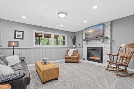 The lower level family room surprises you with how bright and spacious it feels. Fresh carpet, recessed lighting, wainscoting detail & windows that look directly out to the deck above. A genuine bonus space.
