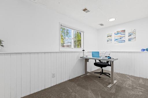 Whether it becomes your office, your hobby room, or a private guest suite, this versatile lower-level space delivers light and calm in equal measure. A blank canvas with great bones already in place.