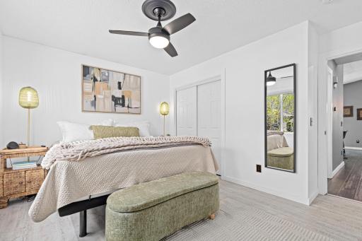 The primary bedroom features updated lighting, a generous closet with organizers, and a serene palette that lets you finally exhale.