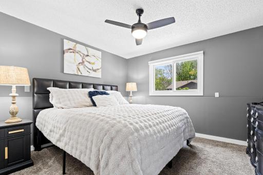 New flooring, fresh paint, updated ceiling fan, this bedroom required nothing and delivers everything.