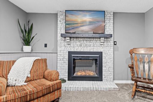 The brick fireplace is the heart of the lower level, classic, warm & completely inviting. The kind of feature that makes a cold Minnesota evening feel like exactly where you want to be.
