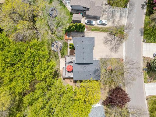 From above, the story becomes clear. Mature trees, a private pond, a generous lot, and a home that sits perfectly within it all. Location, land, and lifestyle in one stunning aerial.
