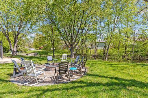There is something about a real stone fire pit â the warmth on your face, the sound of the crackling wood, the way conversation slows down and deepens. This one is surrounded by trees, fresh air, and good neighbors.