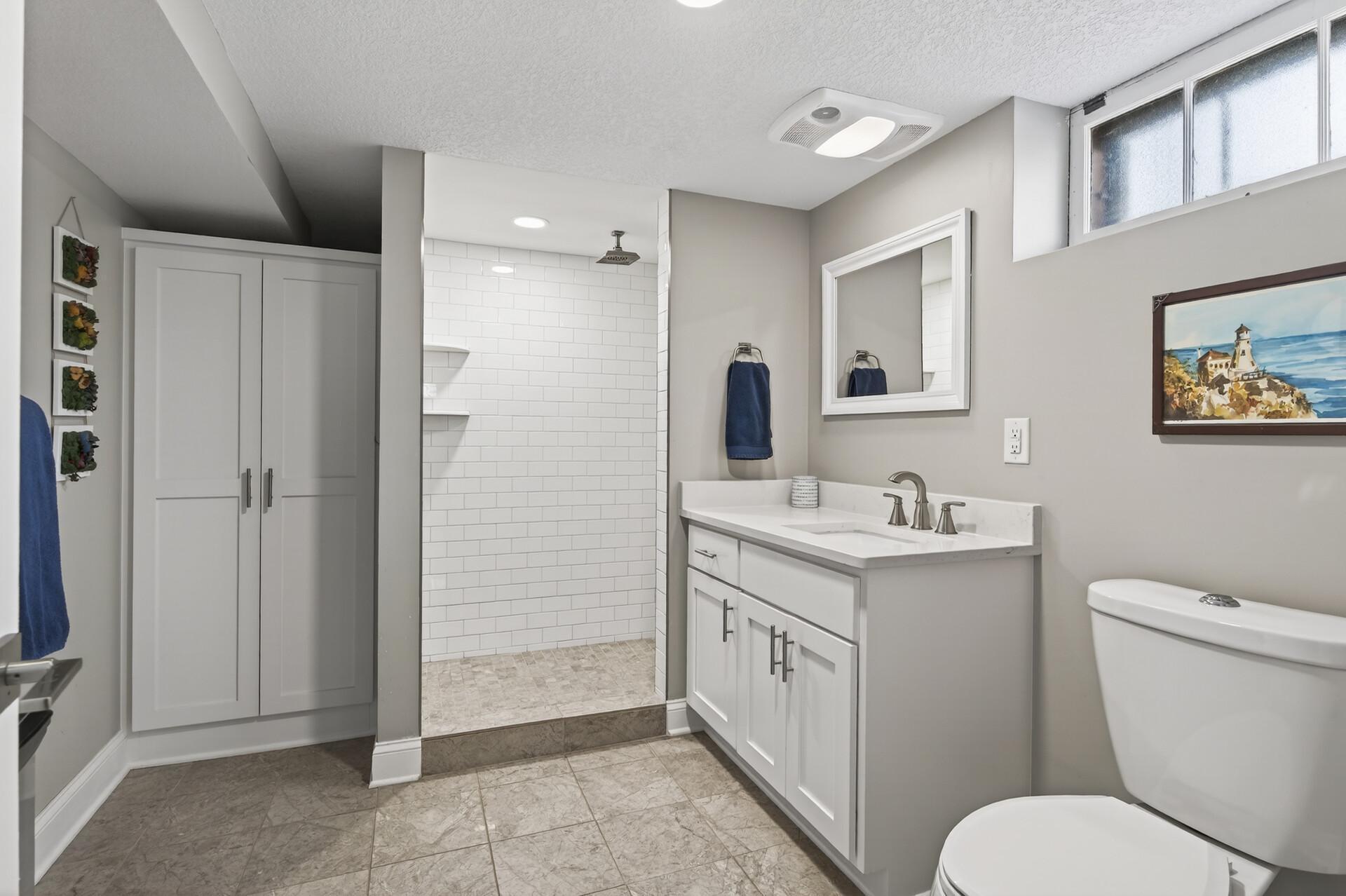 Newer spa-like 3/4 bath in lower level with walk-in shower
