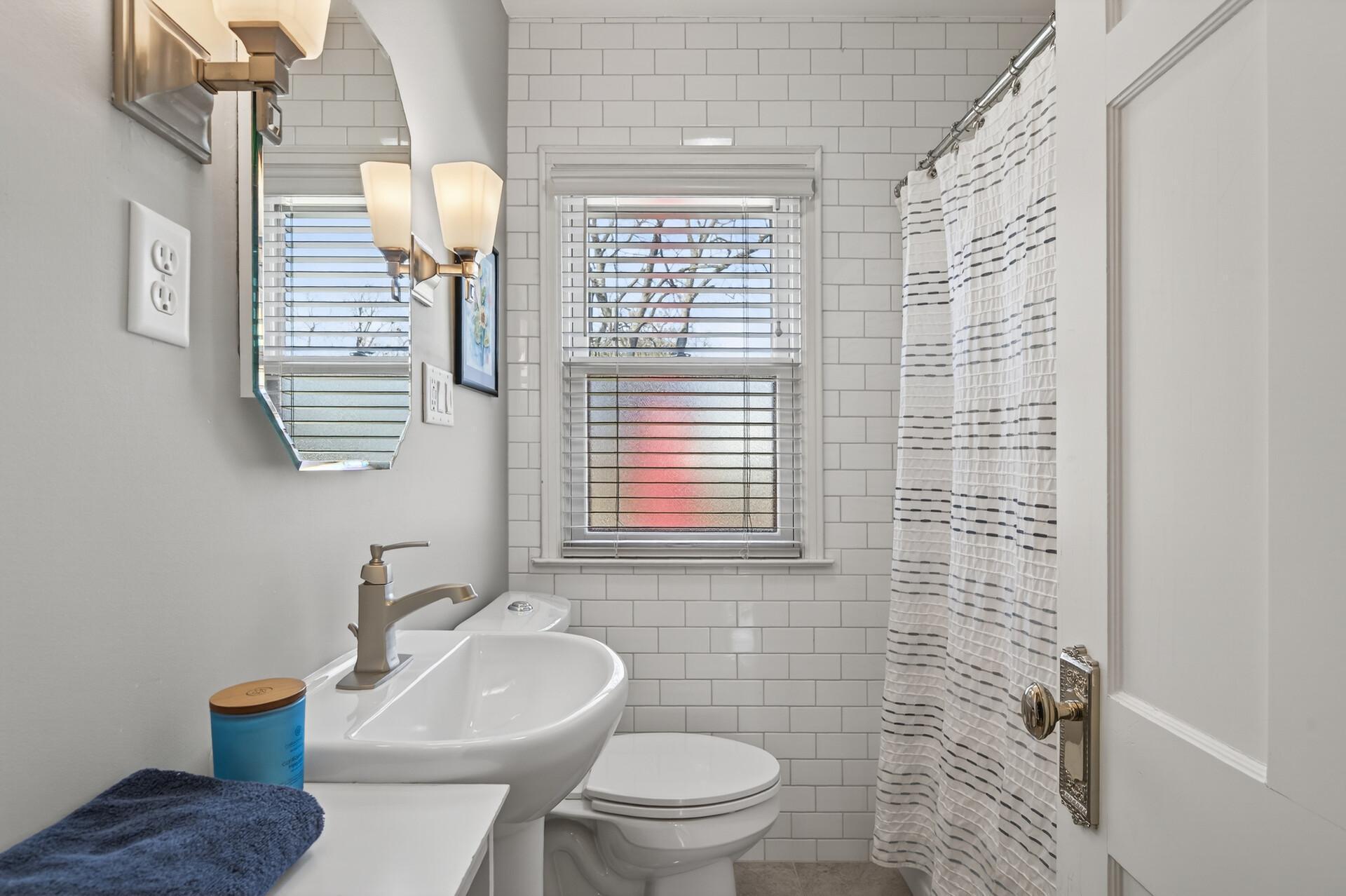 Updated and bright tiled main floor full bathroom