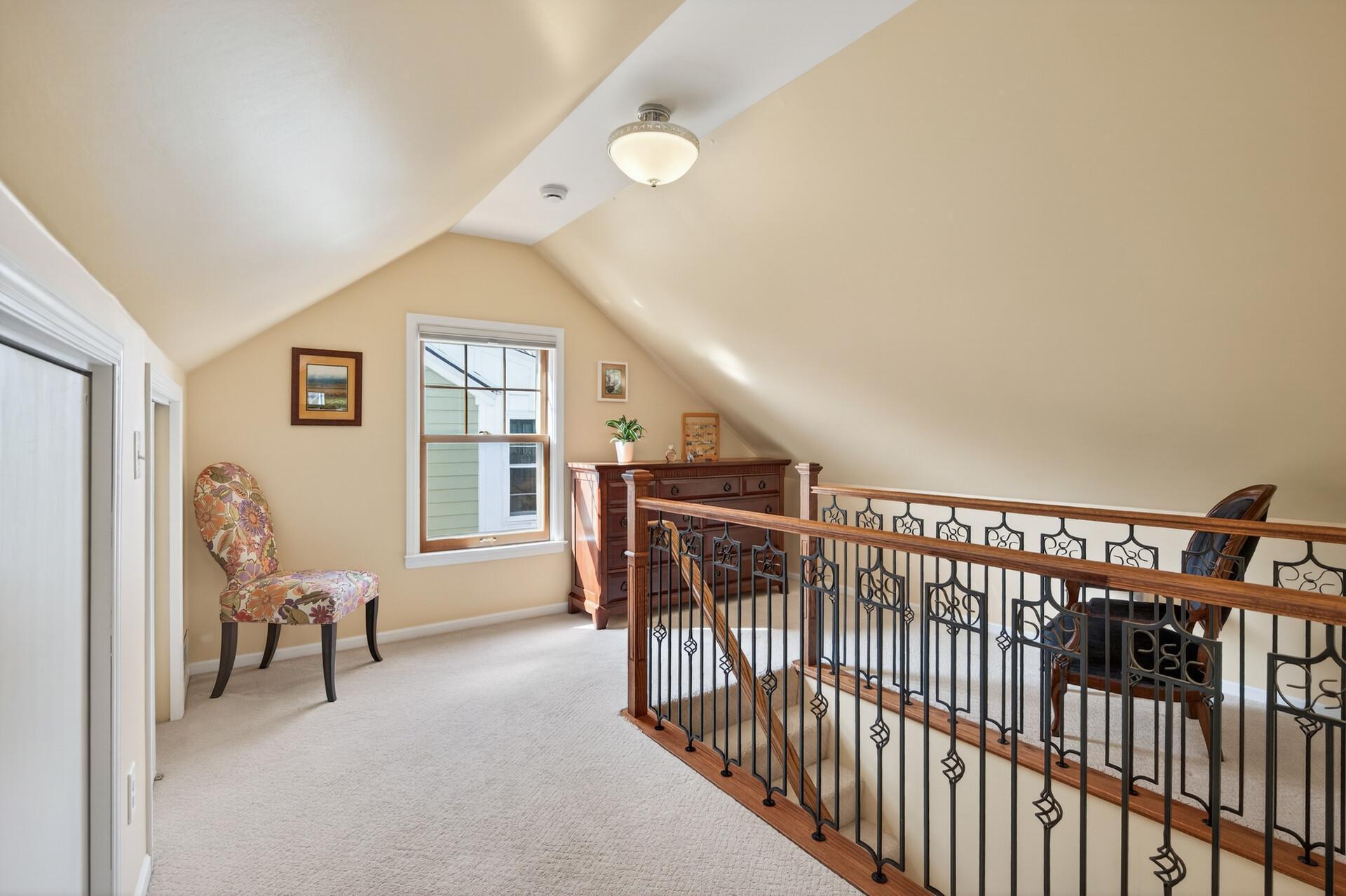Gorgeous staircase to the upper level primary suite