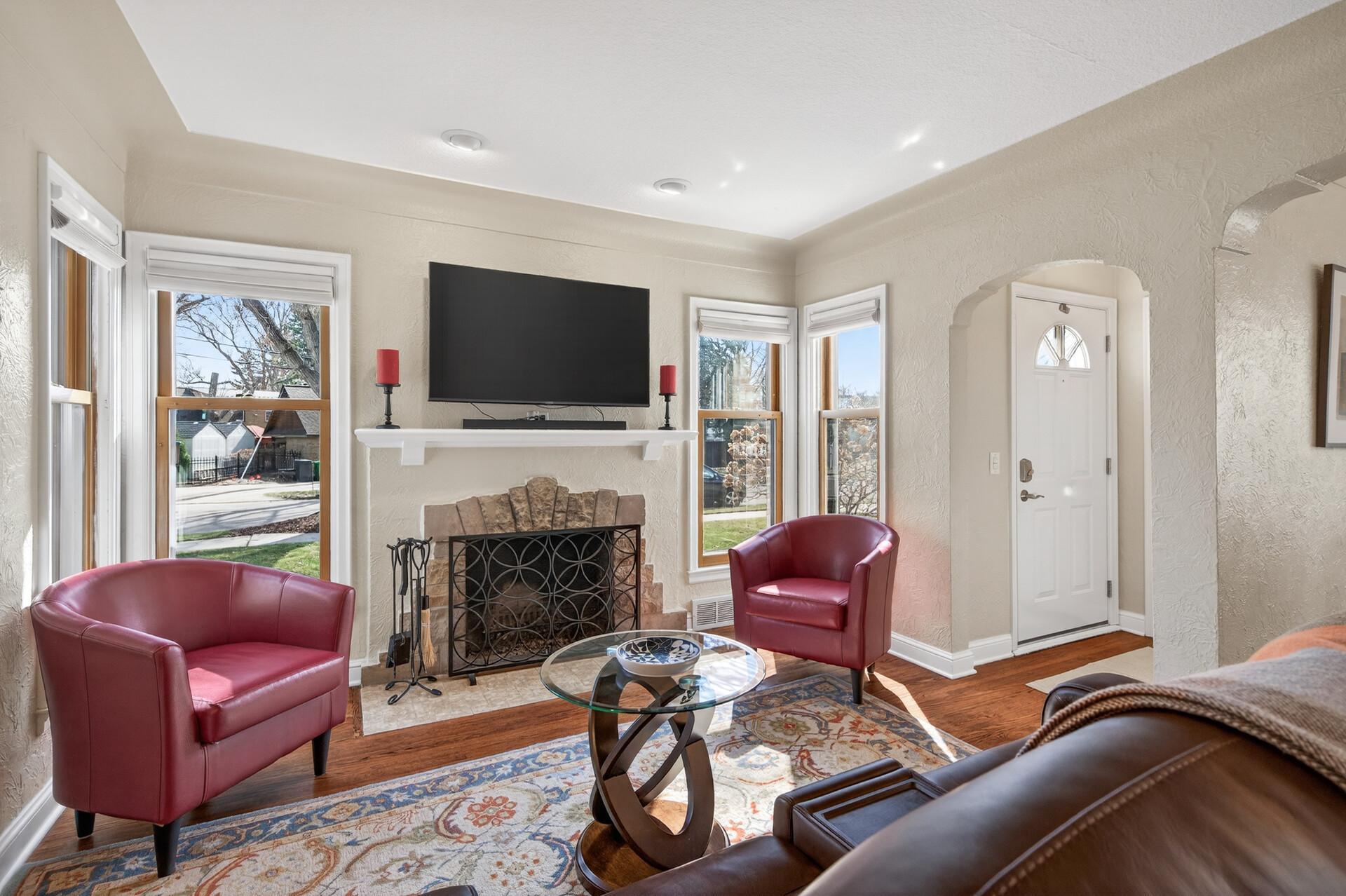 Gorgeous woodburning fireplace has been updated with a steel flue liner and limestone cap on the chimney