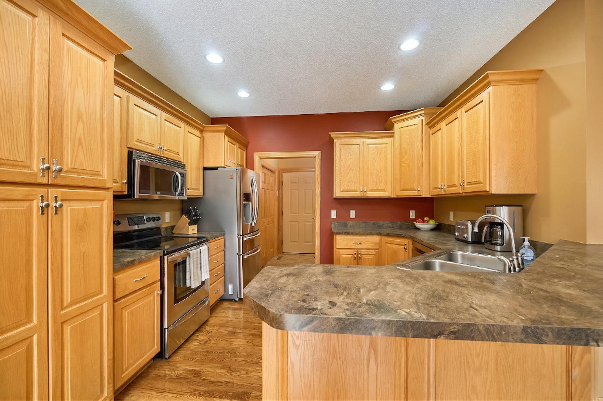 Spacious Kitchen w/ Stainless Steel Appliances - Virtually Rendered