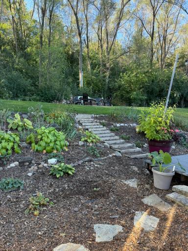 Beautiful landscaping with perennial plants and paver steps back.JPEG