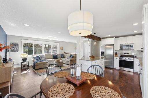 Dining area looking to the living room, beautiful wood flooring on the upper level.