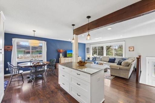View of the kitchen, center island with granite counter tops, dining and living room, great open space to enjoy! center island &dining.jpg