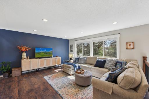 Open living room with a large picture window.