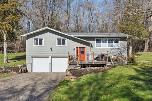 Front view of the home and front deck entrance.