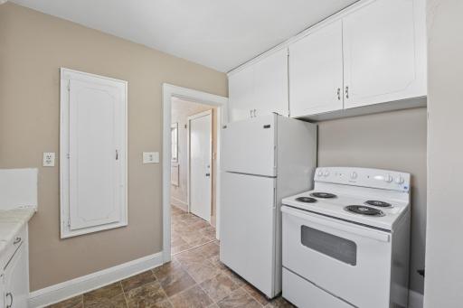 Efficient kitchen layout with full appliance package and easy access to adjacent living areas.