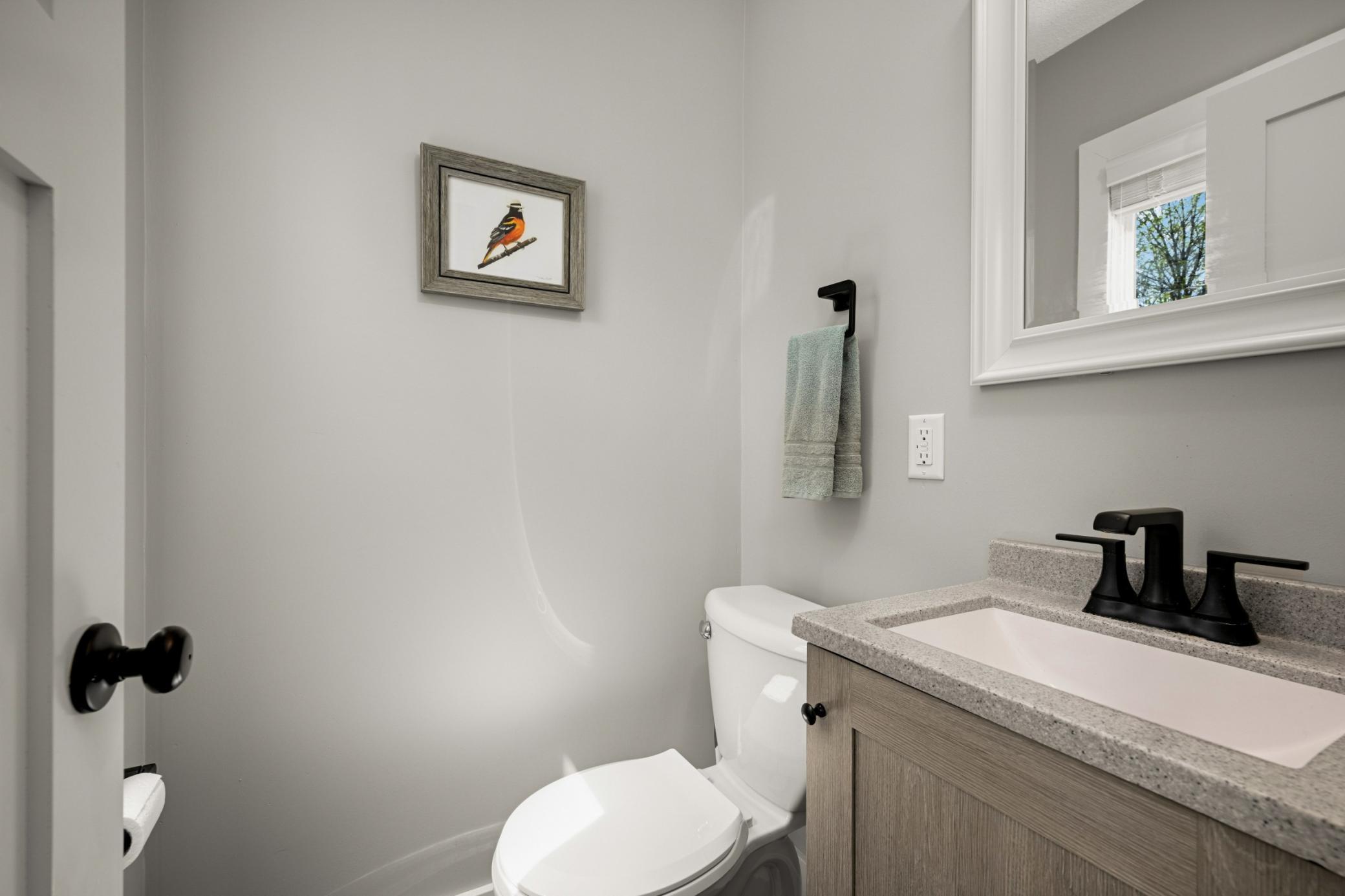 Powder room, right off of the back entry.