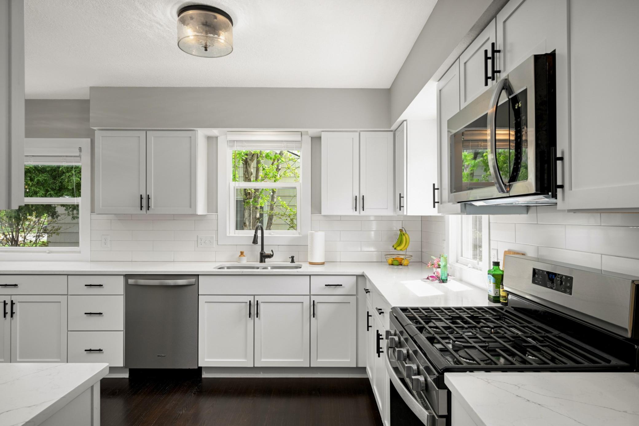 Three kitchen windows let in tons of natural light.