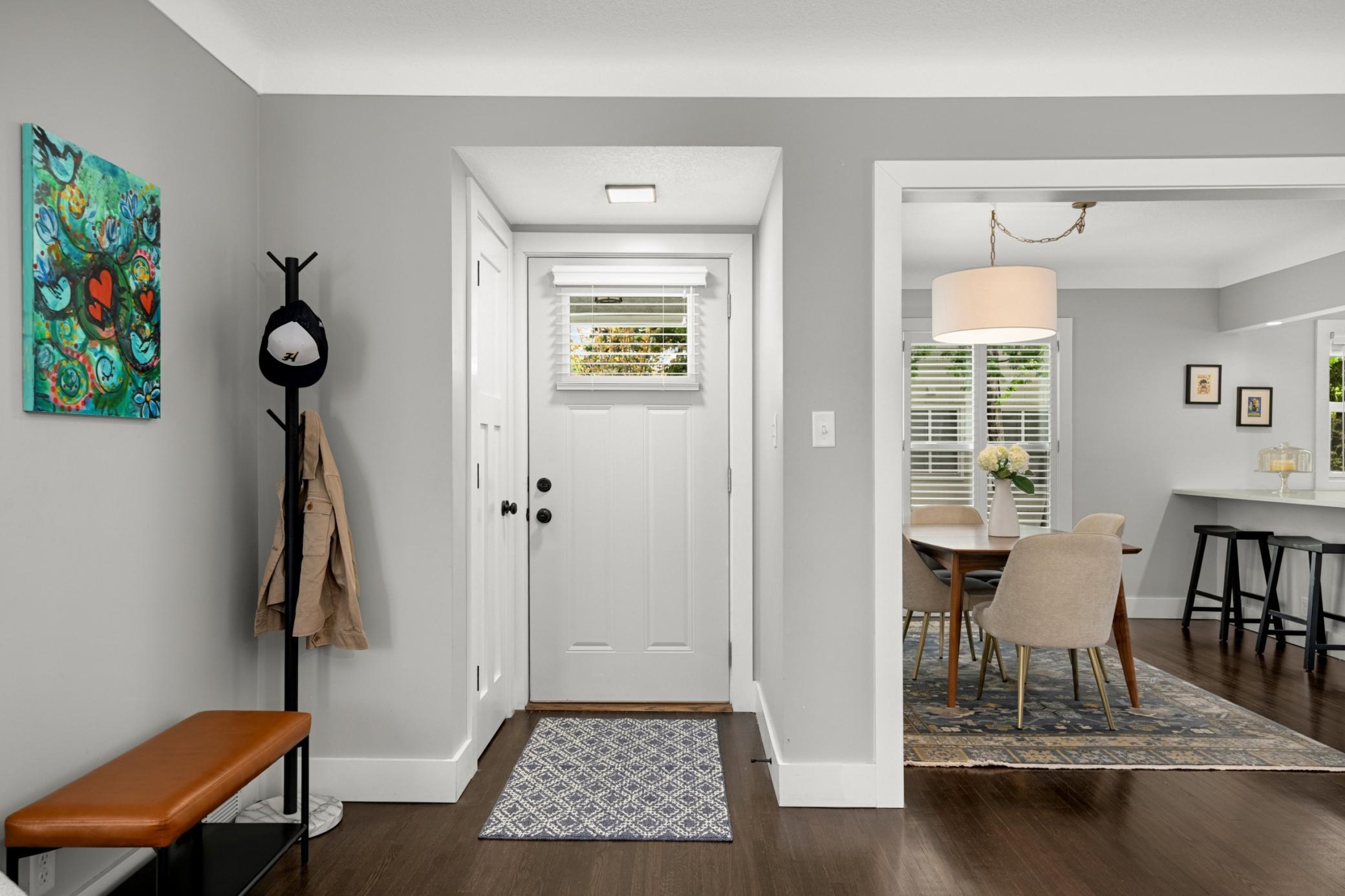 Inviting front entryway with hall closet.