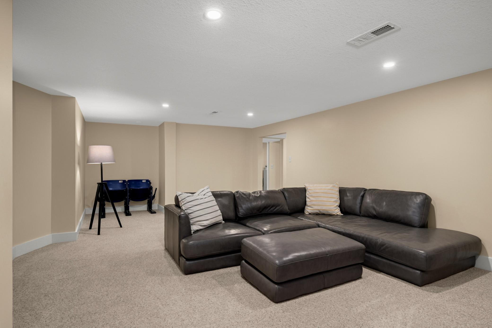 Finished lower level features a family room, bedroom, bathroom, laundry and fitness room