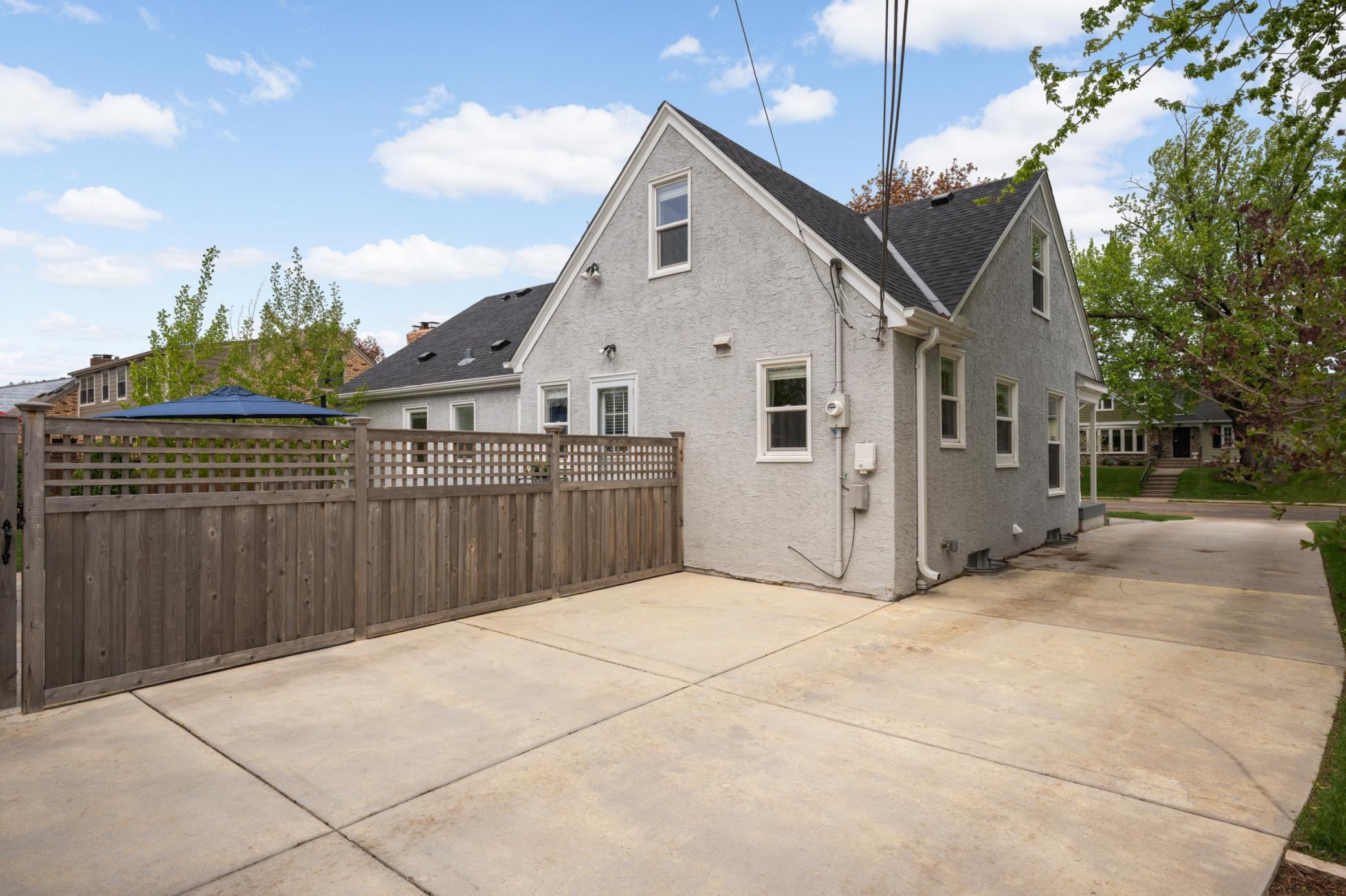 Large concrete driveway with plenty of off-street parking.