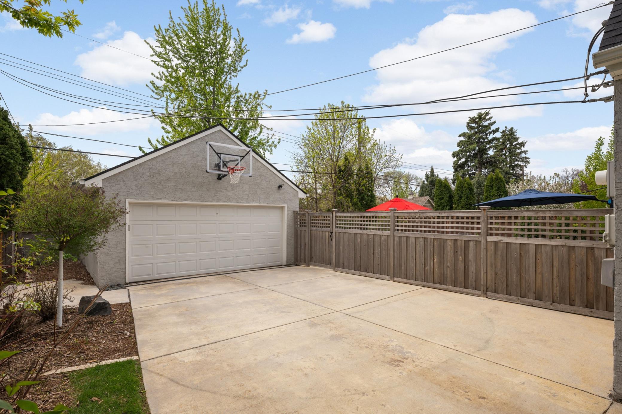 2 car garage with basketball hoop.