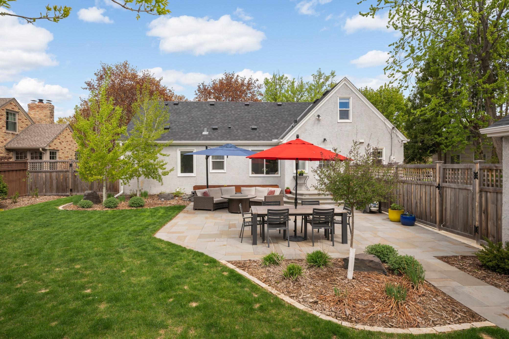 You will have a wonderful summer enjoying your fully fenced, newly landscaped backyard